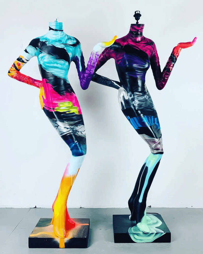 Custom commissioned artwork—painted mannequins with vibrant dripping paint designs