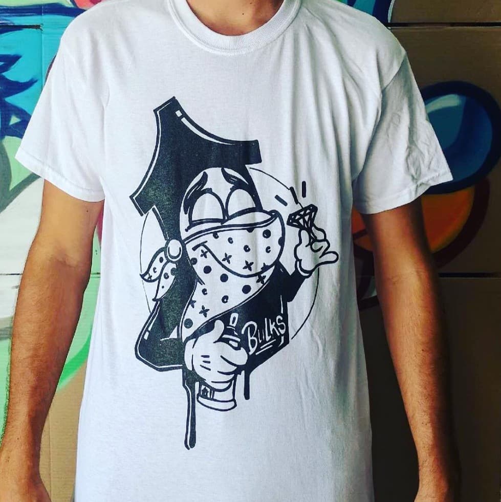 Bulk Styles licensed apparel—graffiti character graphic on t-shirt