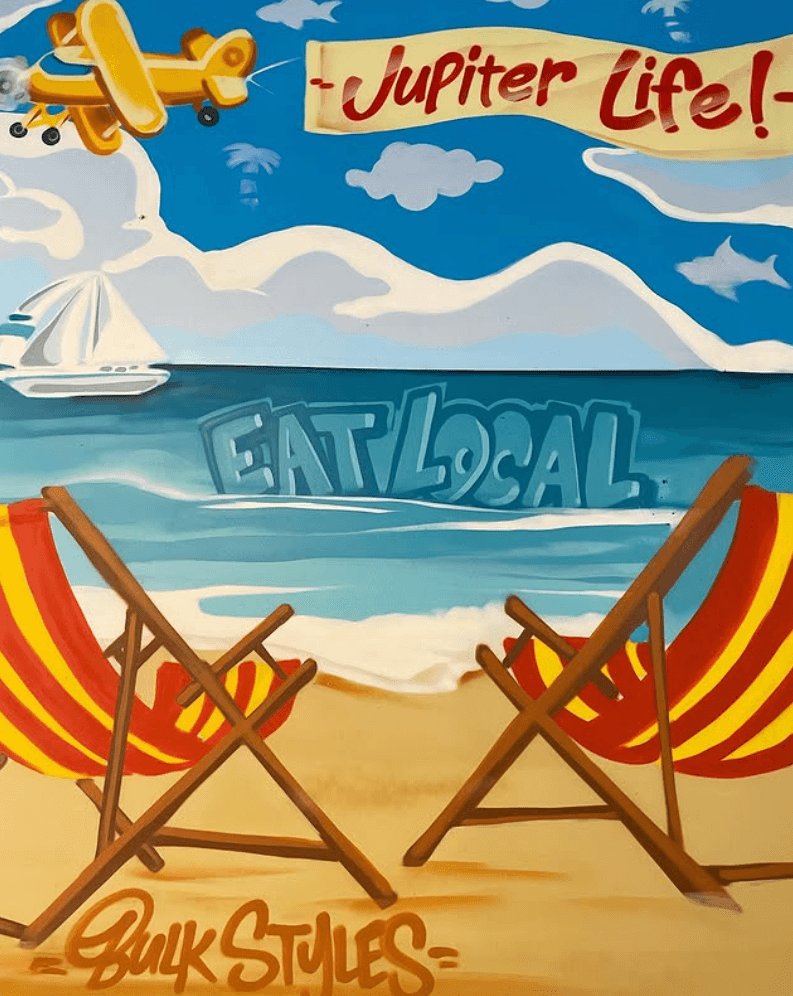 Bulk Styles beach mural with EAT LOCAL, biplane, and beach chairs