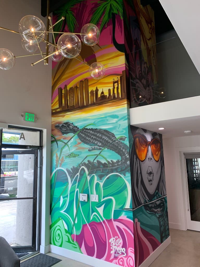 Bulk Styles pillar mural — skyline, alligator, graffiti lettering, and portrait
