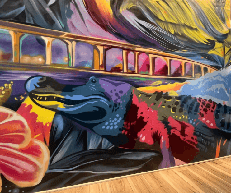 colorful alligator detail from the Waterfront Stuart mural by artist Bulk Styles with the Roosevelt Bridge