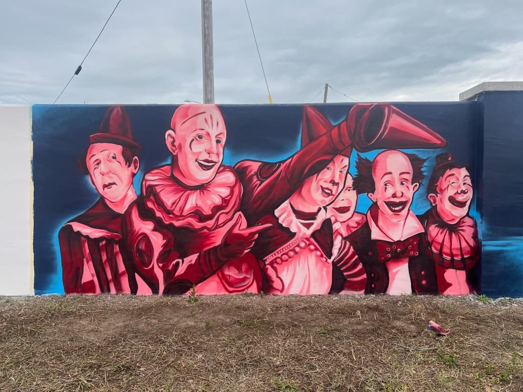 Venice Beach Circus - Stylized clown figures against indigo background