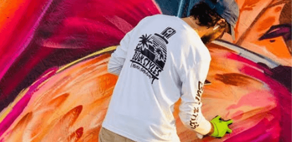 Mark Francis painting a large-scale mural—Bulk Styles in action