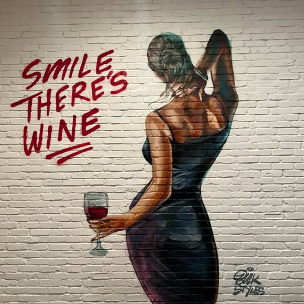 wine themed restaurant mural at Lynora's in West Palm Beach painted by mural artist Mark Francis Bulk Styles