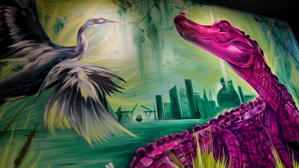 wildlife scene from the Mack House Brew Pub mural in Fort Lauderdale featuring an alligator and heron painted by mural artist Mark Francis Bulk Styles
