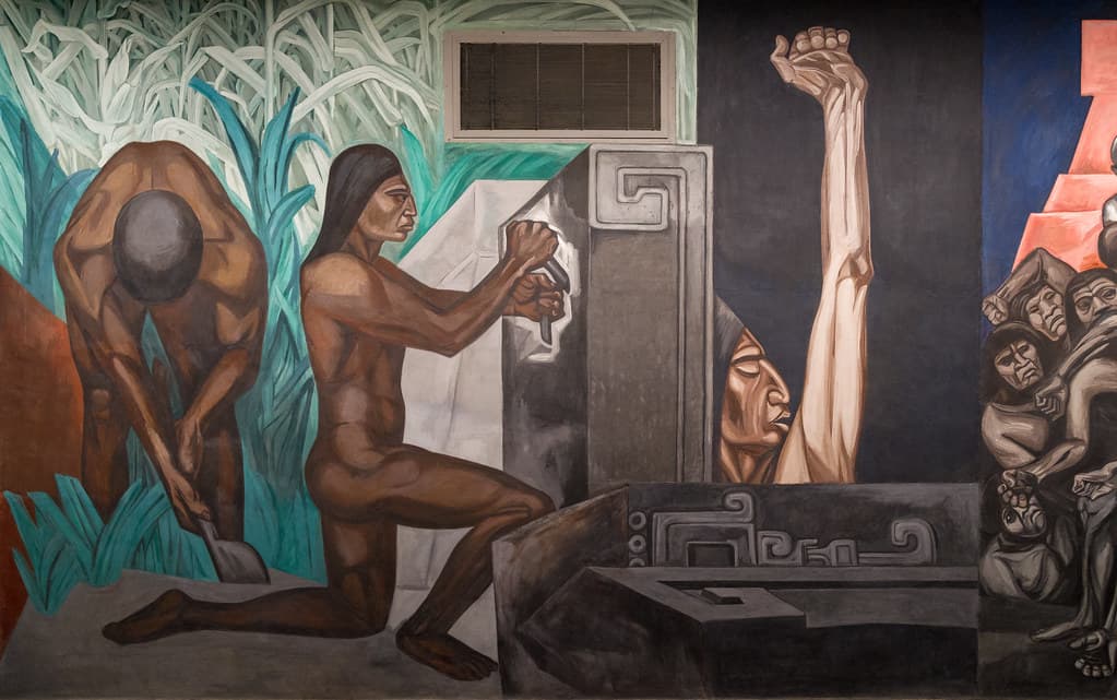 Mexican muralism political mural showing workers carving stone and raising a fist symbolizing revolution