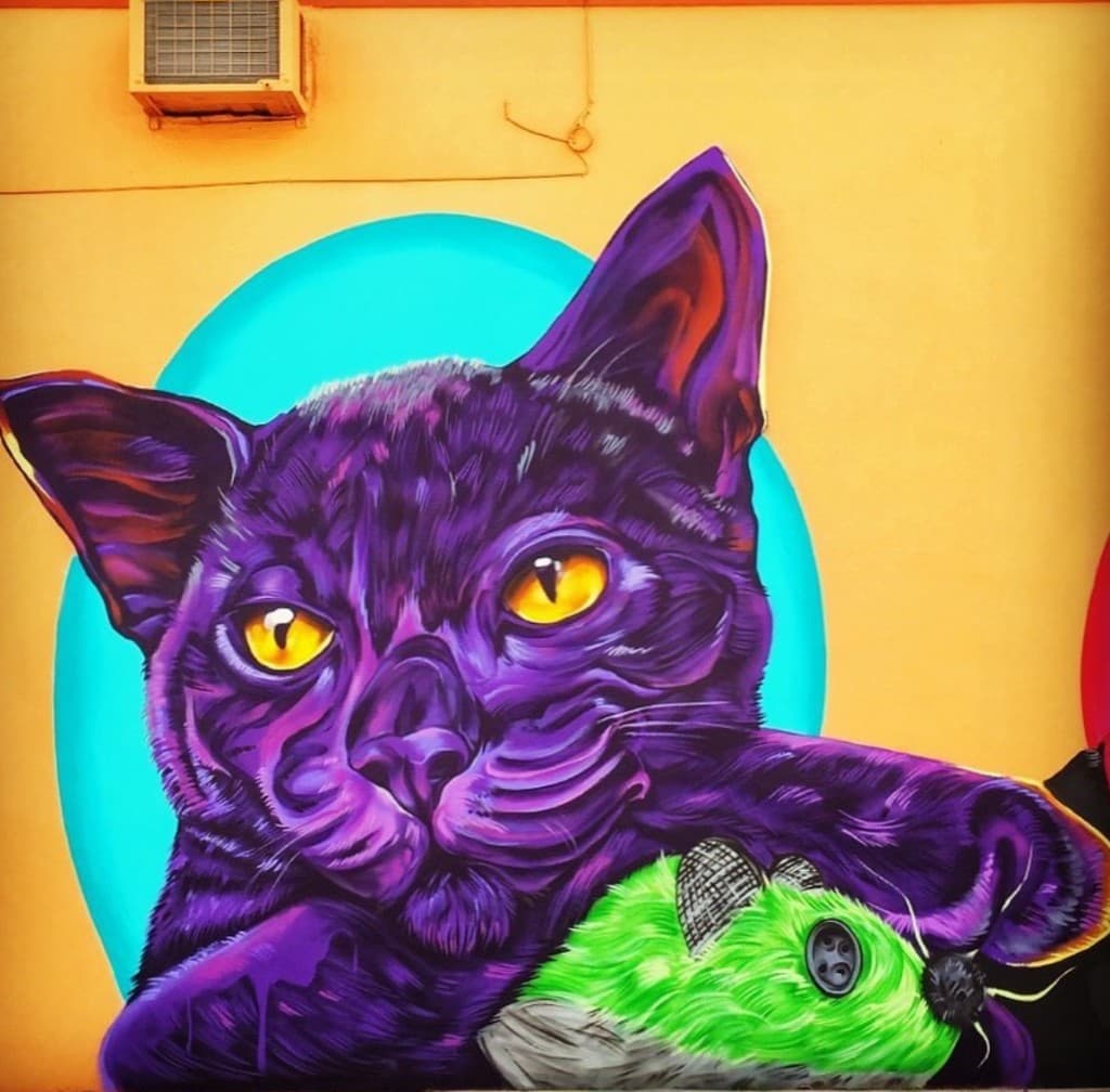 Finished purple cat mural at Paws on the Ave by Mark Francis (Bulk Styles)