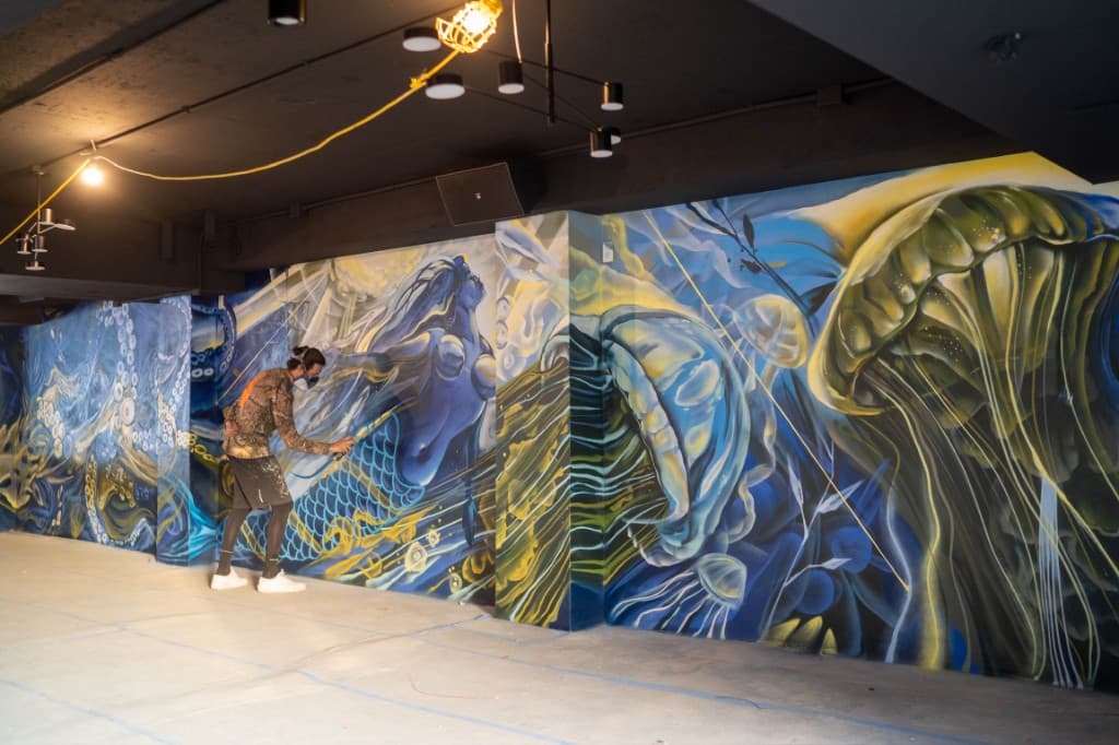 Mark Francis (Bulk Styles) painting a large scale commercial mural installation