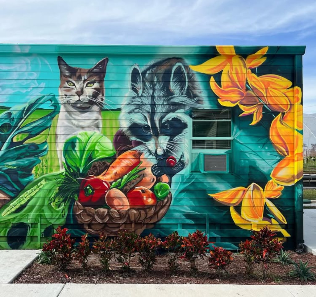 Bulk Styles "Animals Gone Wild" mural at Kai-Kai Farm — cat, raccoon, and produce basket